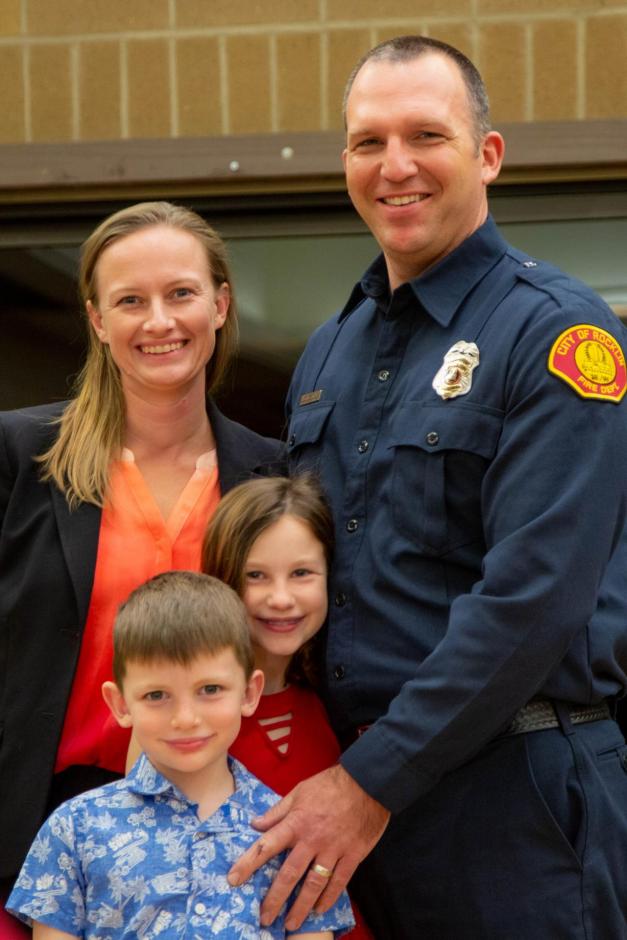 Kevin Stenson stands with his family as a new Rocklin firefighter.